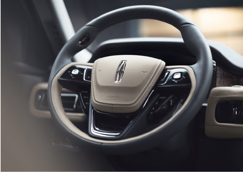 The intuitively placed controls of the steering wheel on a 2023 Lincoln Aviator® SUV | Golden Circle Lincoln in Jackson TN